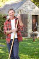 Man working in country garden