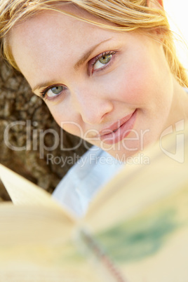 Portrait of young woman reading