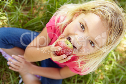 Portrait of happy girl with apple