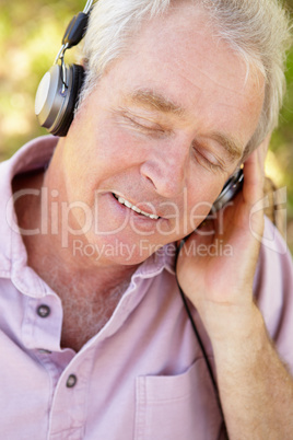 Senior man with headphone