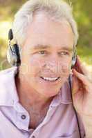 Senior man with headphone