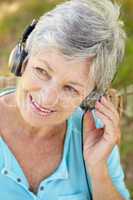 Senior woman with headphone