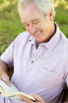 Senior man reading a book