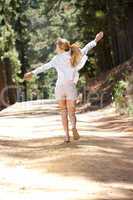 Woman running along country lane