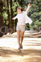 Woman running along country lane