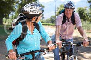 Senior couple on country bike ride