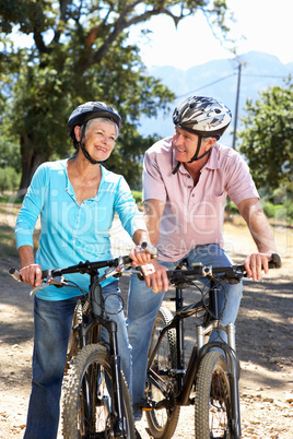 Senior couple on country bike ride