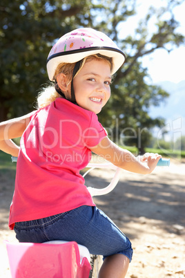 Little girl on country bike ride
