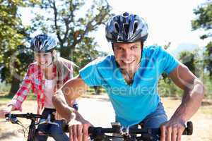 Young couple on country bike ride