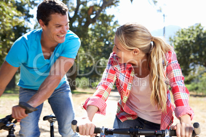 Young couple on country bike ride