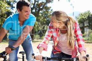 Young couple on country bike ride