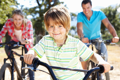 Young family on country bike ride