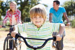 Young family on country bike ride