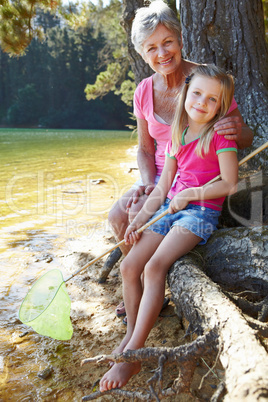 Woman and girl fishing together