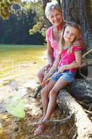 Woman and girl fishing together