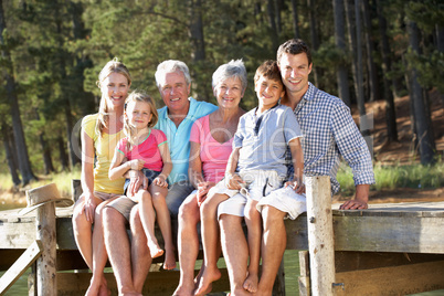 3 Generation family sitting by lake