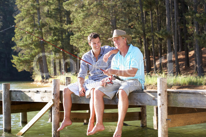 Father and adult son fishing together