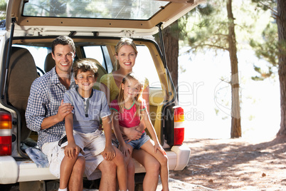 Young family on day out in country
