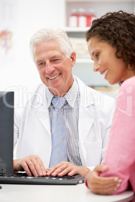 Senior doctor with female patient
