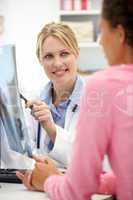 Young doctor with female patient