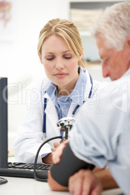 Young doctor with senior patient