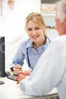 Young doctor with senior patient