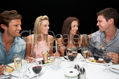 Two young couples in restaurant
