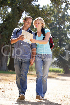 Couple with map on country walk