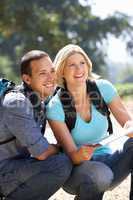 Couple with map on country walk