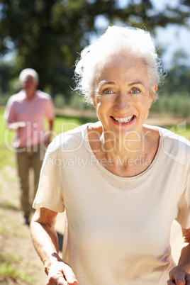 Senior couple on country run