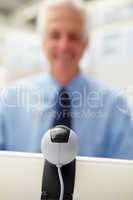 Senior businessman using skype