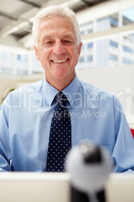 Senior businessman using skype