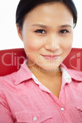 Young woman sitting in chair