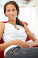 Young woman sitting in chair