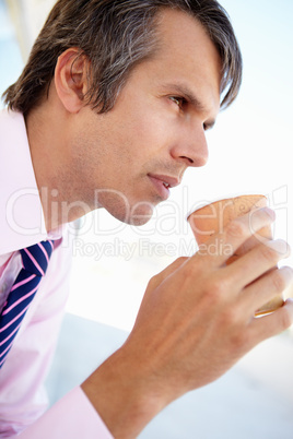 Businessman drinking coffee