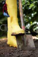 Woman digging in garden