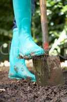 Person digging in garden
