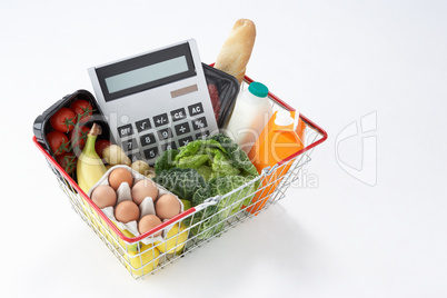 Basket of groceries and calculator