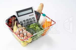 Basket of groceries and calculator