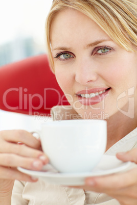 Woman relaxing with cup of tea