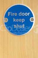 Keep shut sign on fire door