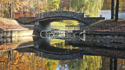 Stone Bridge In Autumn Park