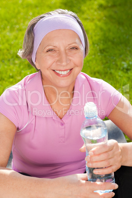 Senior sportive woman smile hold bottle water