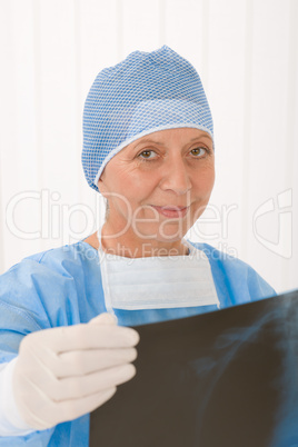 Senior surgeon female hold x-ray protective overall