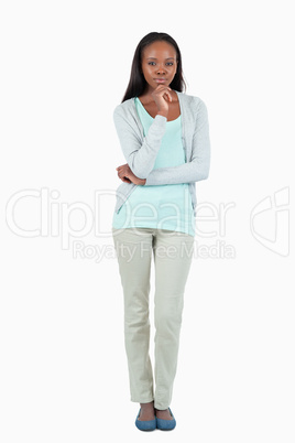 Young woman with hand on her chin
