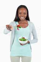 Young woman offering some salad