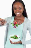 Salad offered by smiling young woman