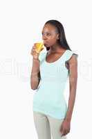 Young woman drinking orange juice