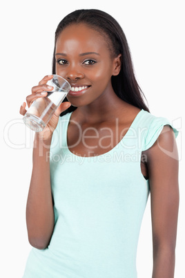 Happy smiling woman having a glass of water