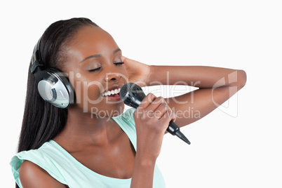 Young woman enjoys singing